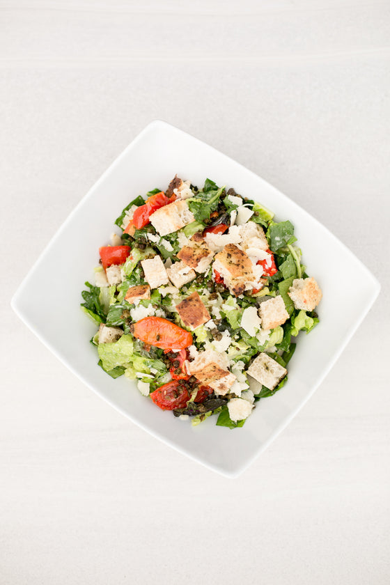 Baby Kale Caesar. Focaccia Croutons, Crispy Capers, Marinated Tomatoes, Lemony Caesar Vinaigrette